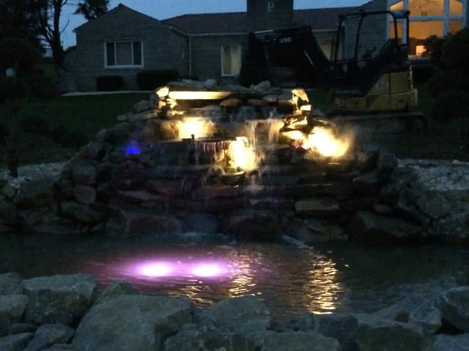 Boulder feature with ambient uplighting at dusk
