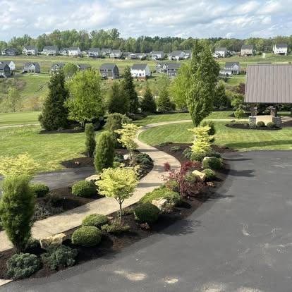 Custom landscape design with curved walkway and gazebo